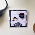 Pines taza y arcoíris